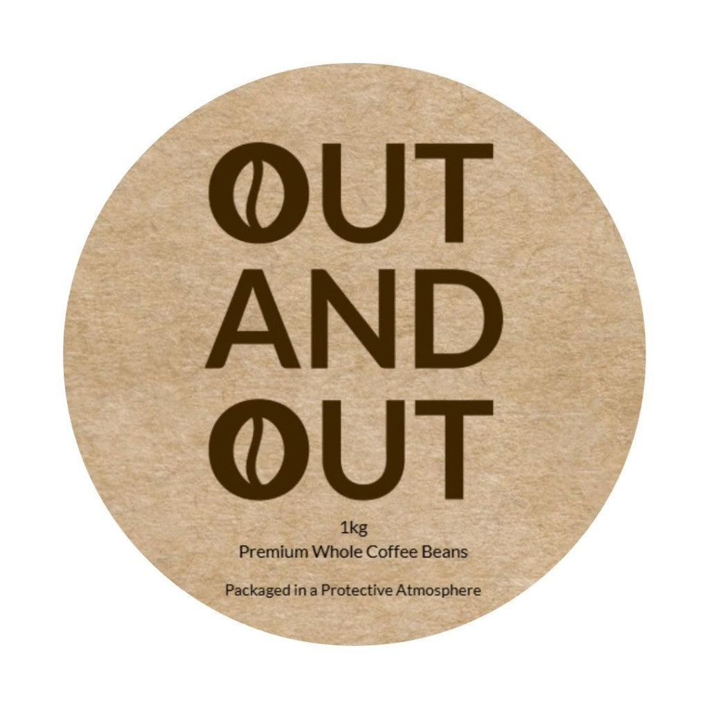 Close-up of OUT AND OUT Coffee 1kg bag label showing premium blend details and logo.