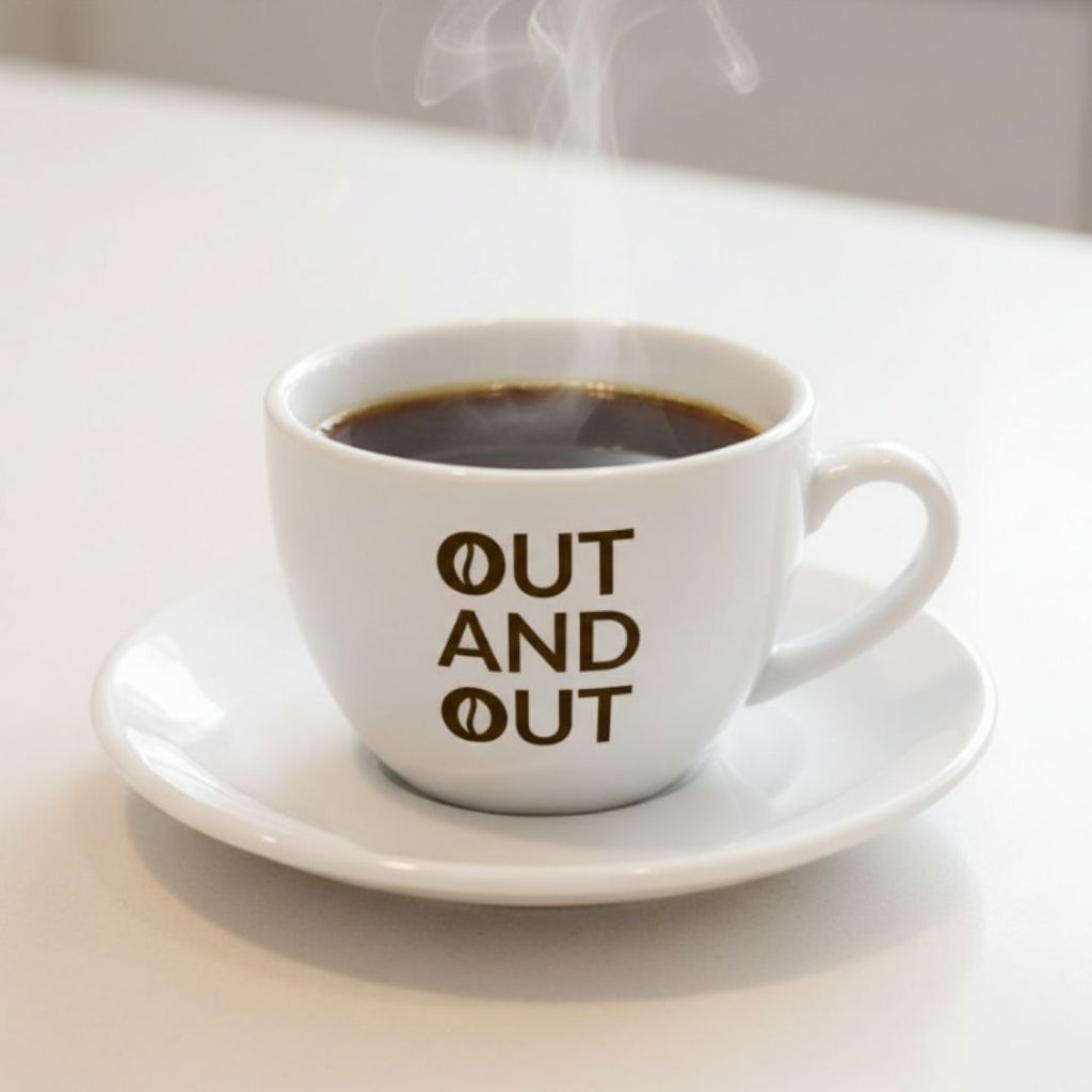 Americano in a white cup featuring OUT AND OUT Coffee logo on the cup.